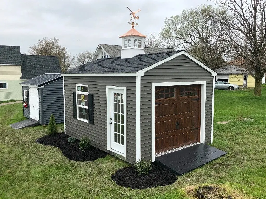 A shed with a door and window in it