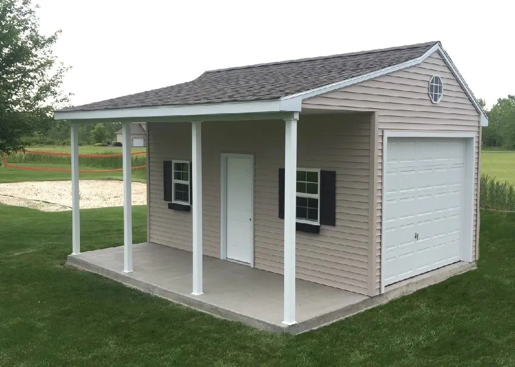 A shed with a porch and two windows.