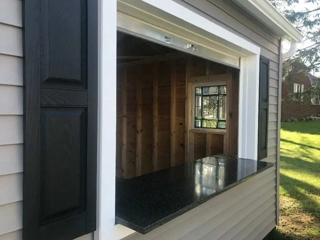 A garage door that is open and has black glass.