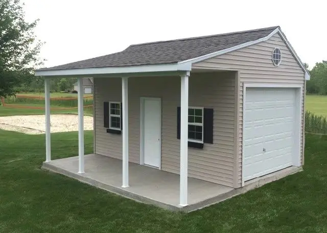 A small garage with a porch and a door.