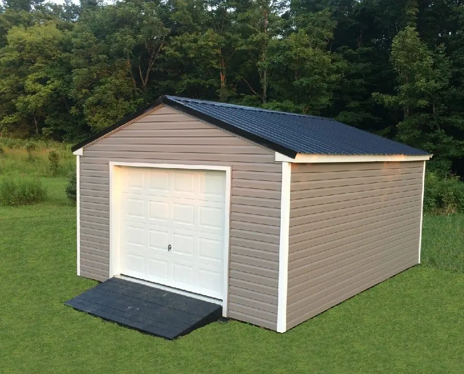 a shed with brown walls, black roof, and a large door