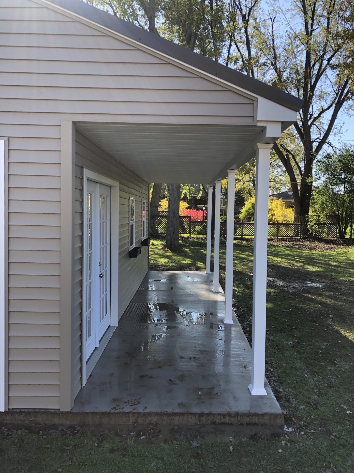 A house with a porch and a door way.