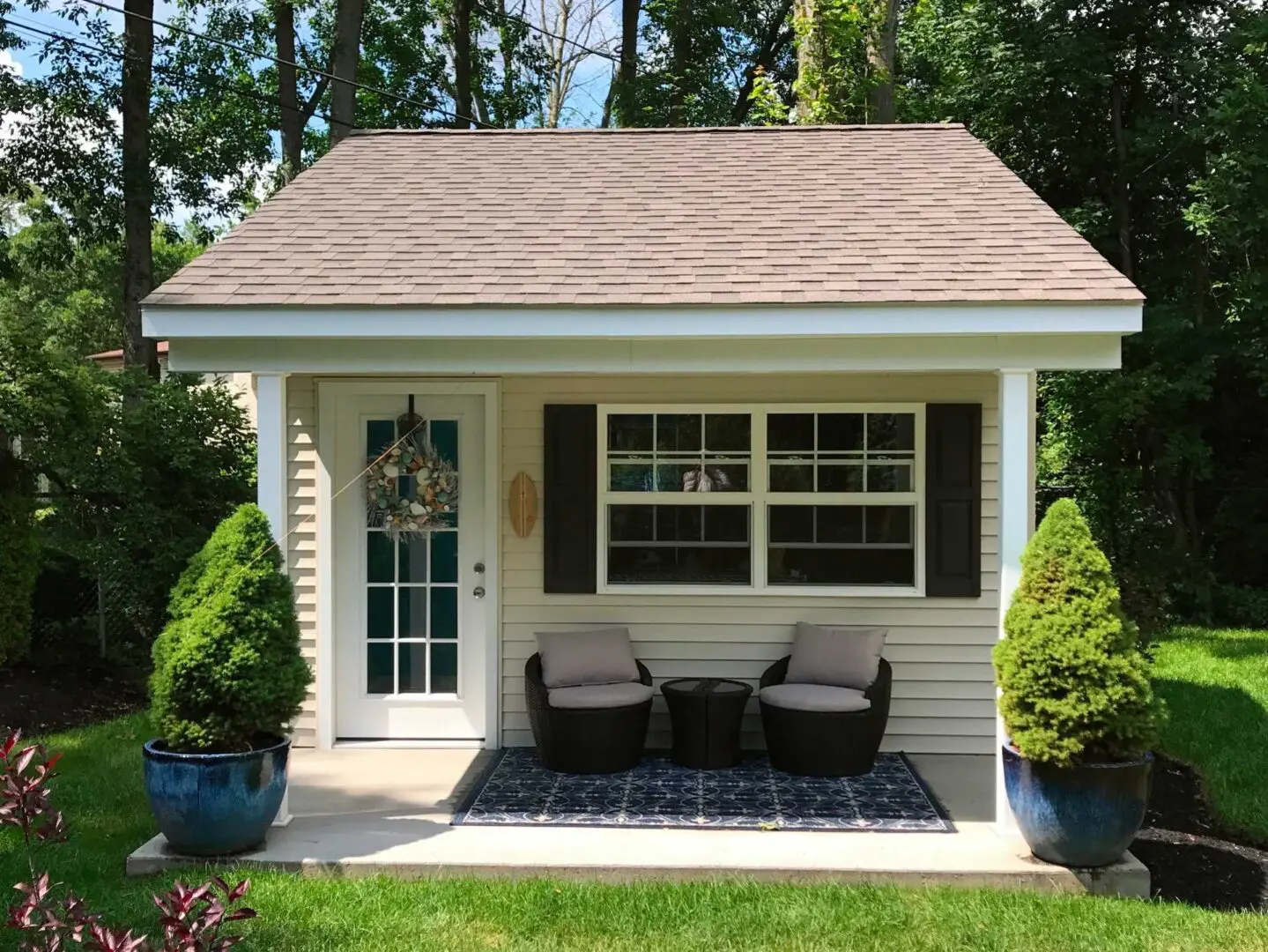 A small house with two chairs and a table