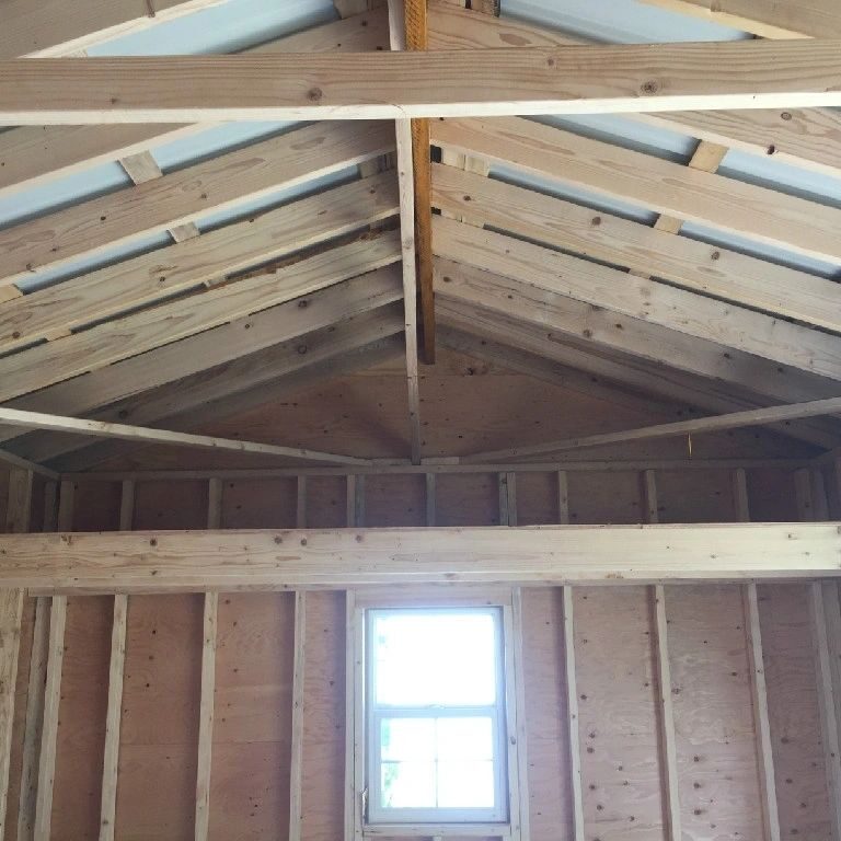 A room with wooden walls and ceiling.