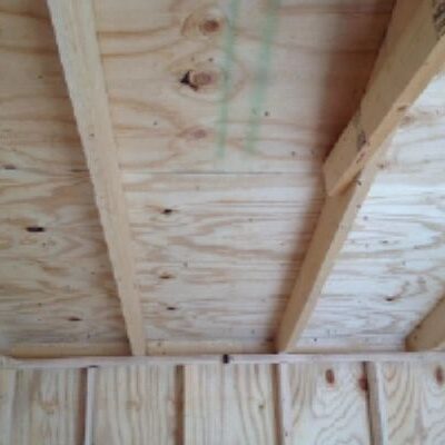 A wooden ceiling with some green lines on it