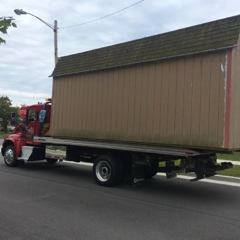 A truck with a trailer on the back of it