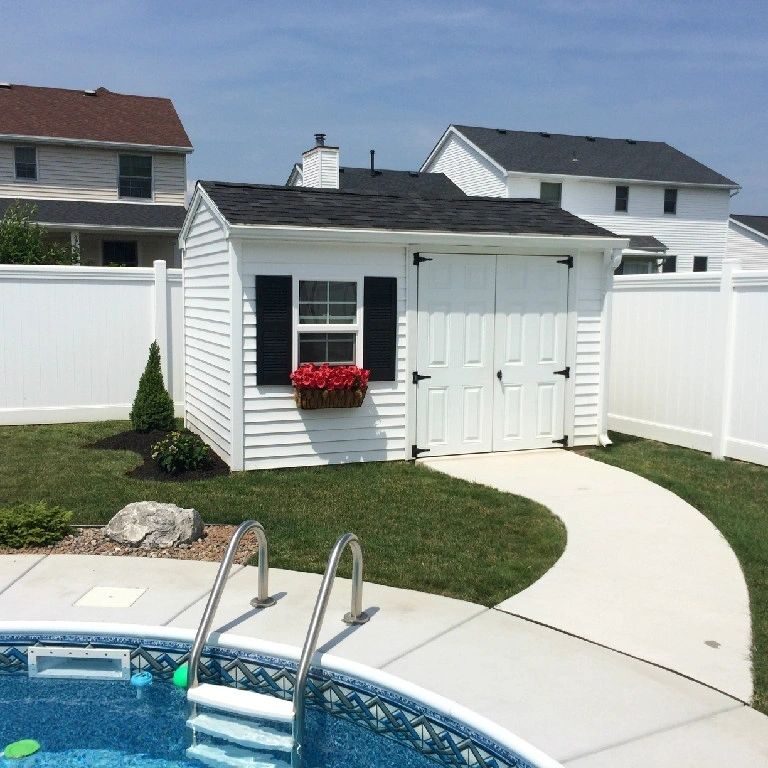 A pool and some houses in the background