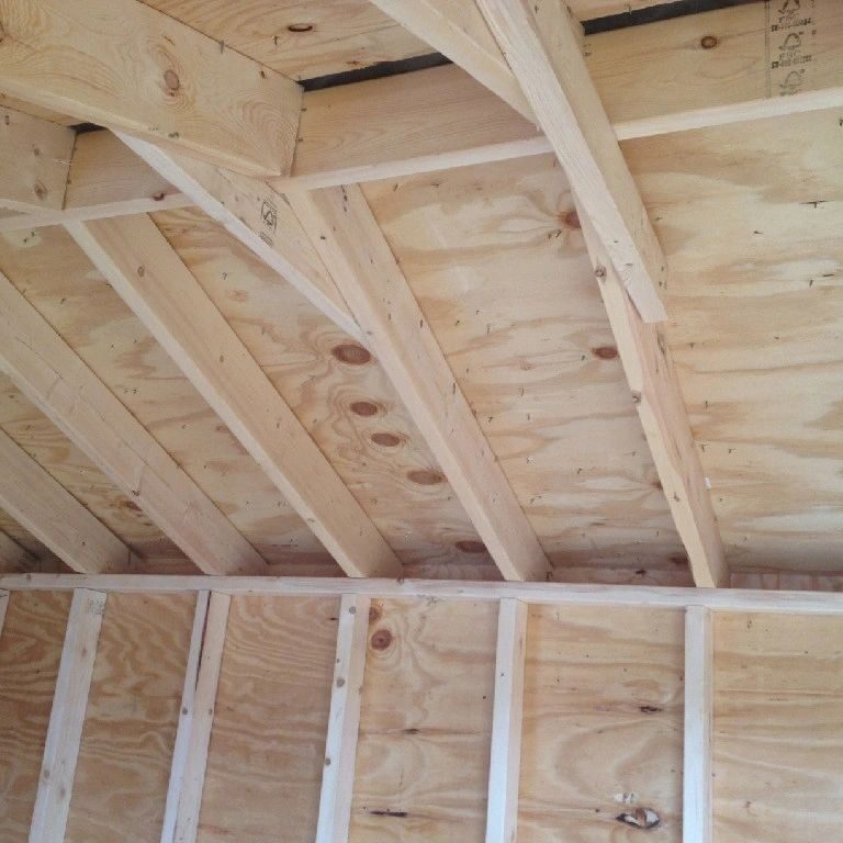 A wooden ceiling in the middle of construction.