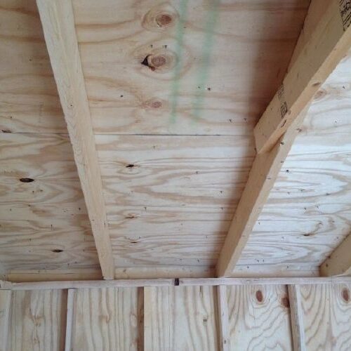 A wooden ceiling with some green lines on it