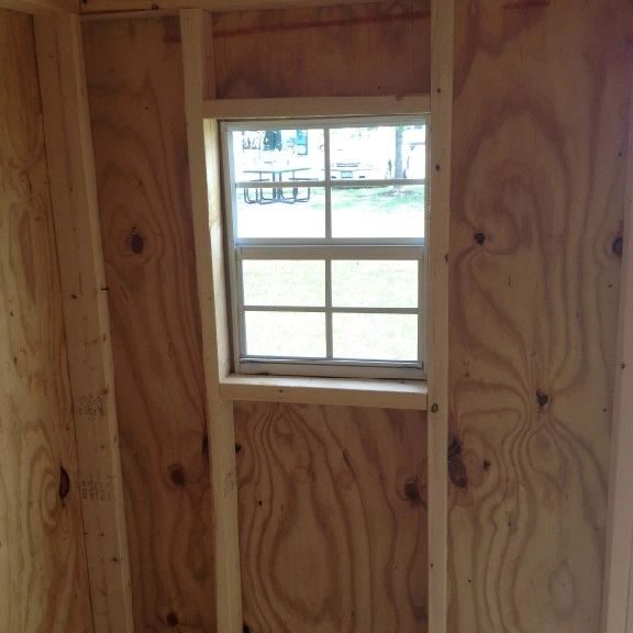 A window in the wall of a shed.